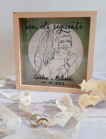Cuadro personalizado de Lletres i Scrap con la ilustración de una pareja y sus nombres en caligrafía